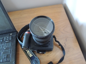 Lens was fine. This is the lens filter. If you have a DSLR go buy a lens filter. $12 will save your lens!