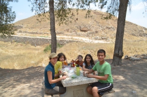 Lunch in front of the Assyrian siege ramp at Lachish.